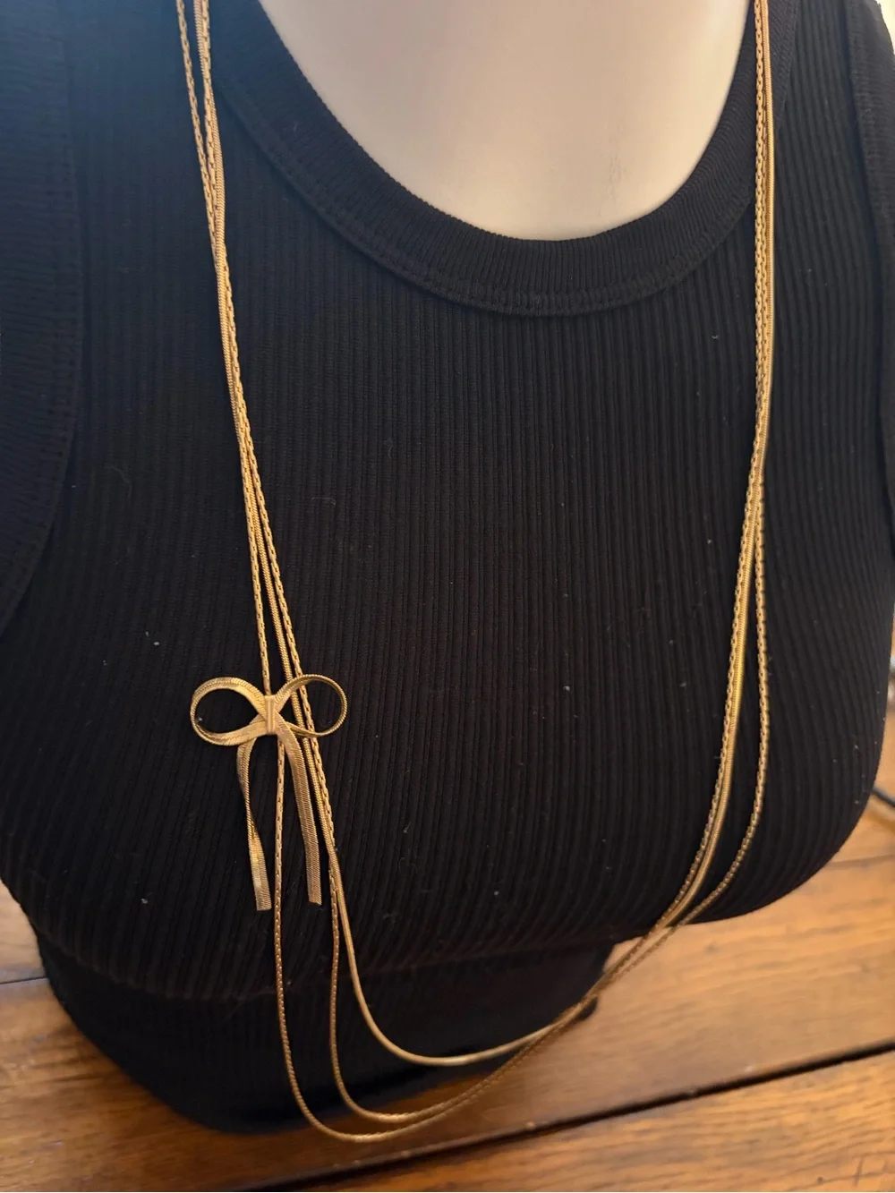 Candie's Long Multi-Strand Gold Tone Necklace with Bow Pendant
